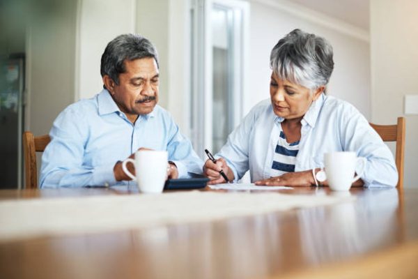 Cropped shot of a senior couple doing their household finances while sitting at home